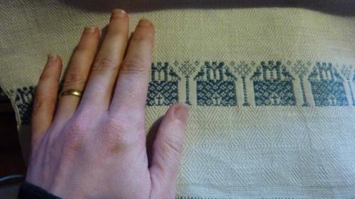Detail-of-Perugia-towel -with-my-hand-for-scale-these-are-fine-and-soft